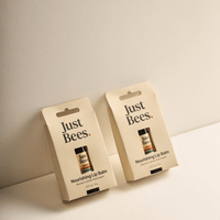 Just Bees Nourishing Lip Balm duo in stylish packaging for natural lip care and hydration.