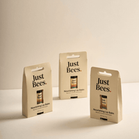 Just Bees Nourishing Lip Balm trio in eco-friendly packaging, perfect for dry lips and a natural skincare routine.