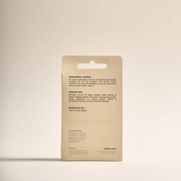 Back label of Just Bees natural lip balm with ingredient list and details