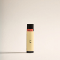 Side view of Just Bees lip balm showing safety seal labeled "Still Pure"